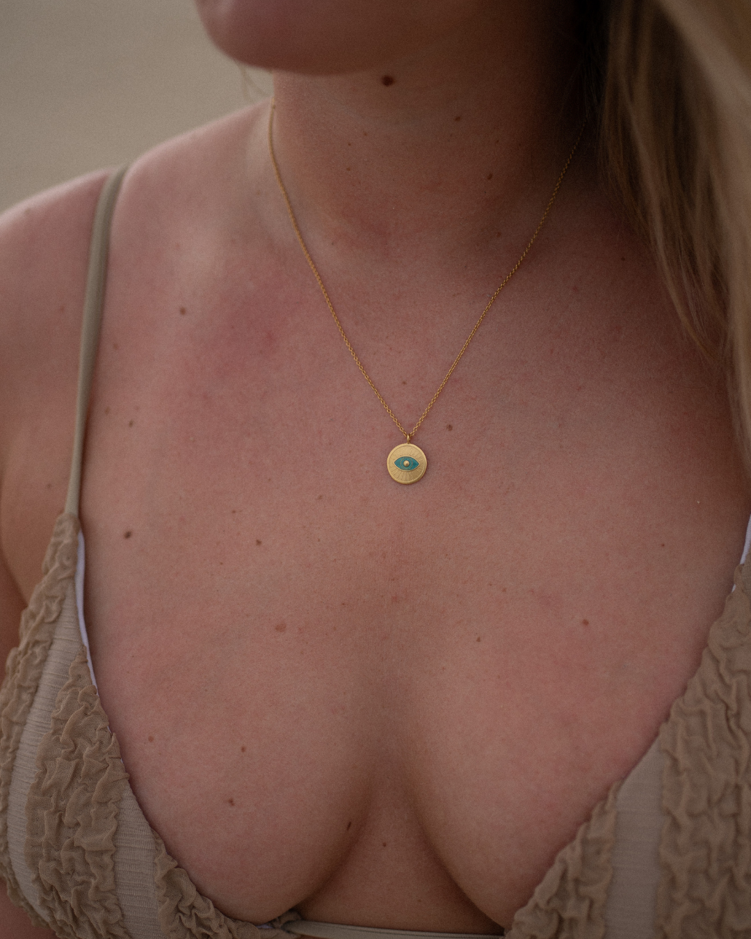 Necklace with magic eye in turquoise - 18 carat gold plated