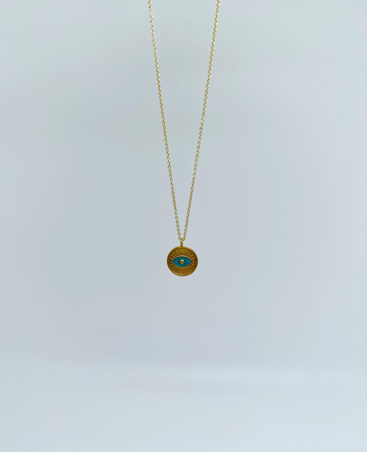 Necklace with magic eye in turquoise - 18 carat gold plated